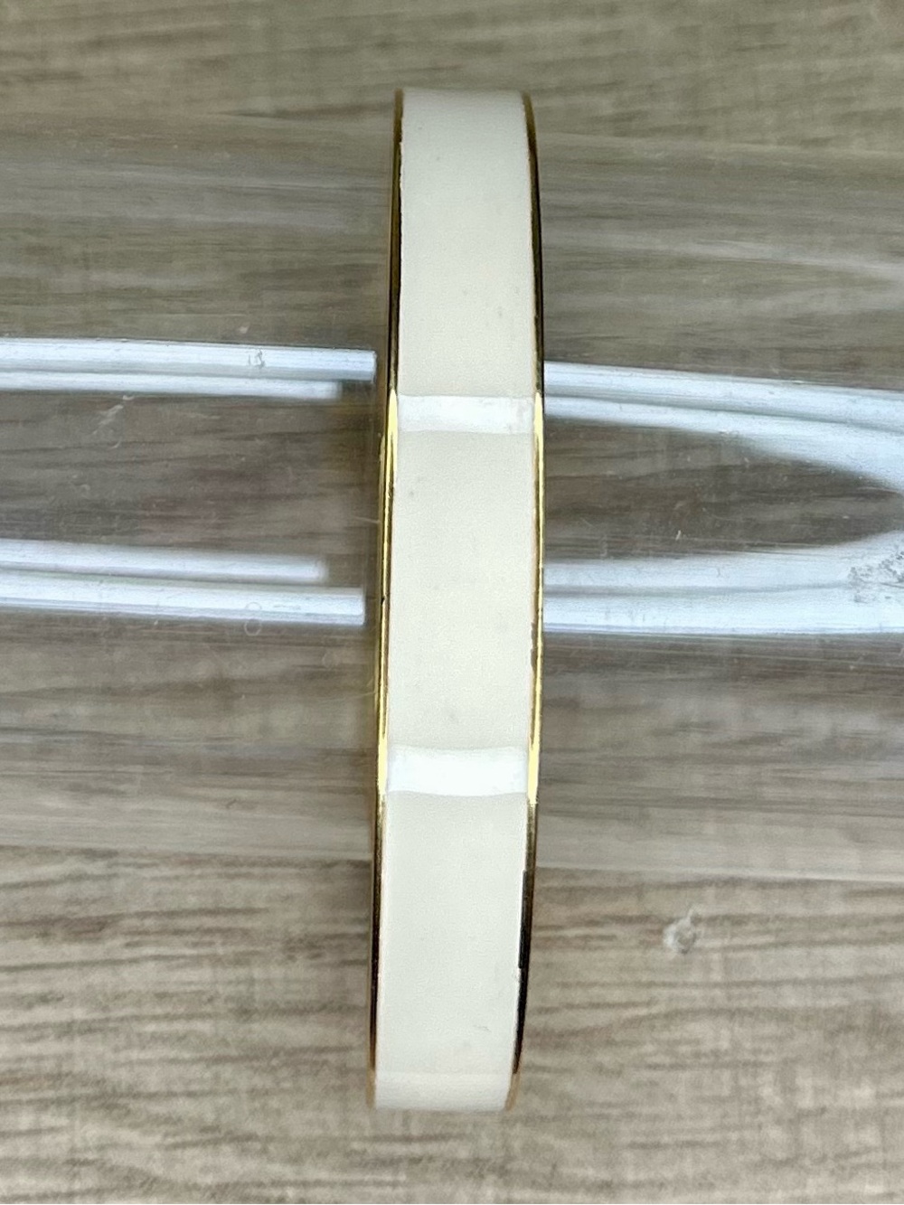 Crown Trifari gold-tone bangle bracelet with a milk white enamel center vintage